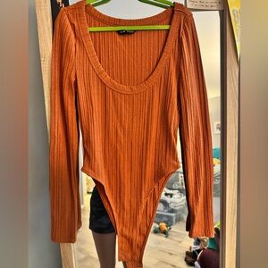 Orange ribbed body suit